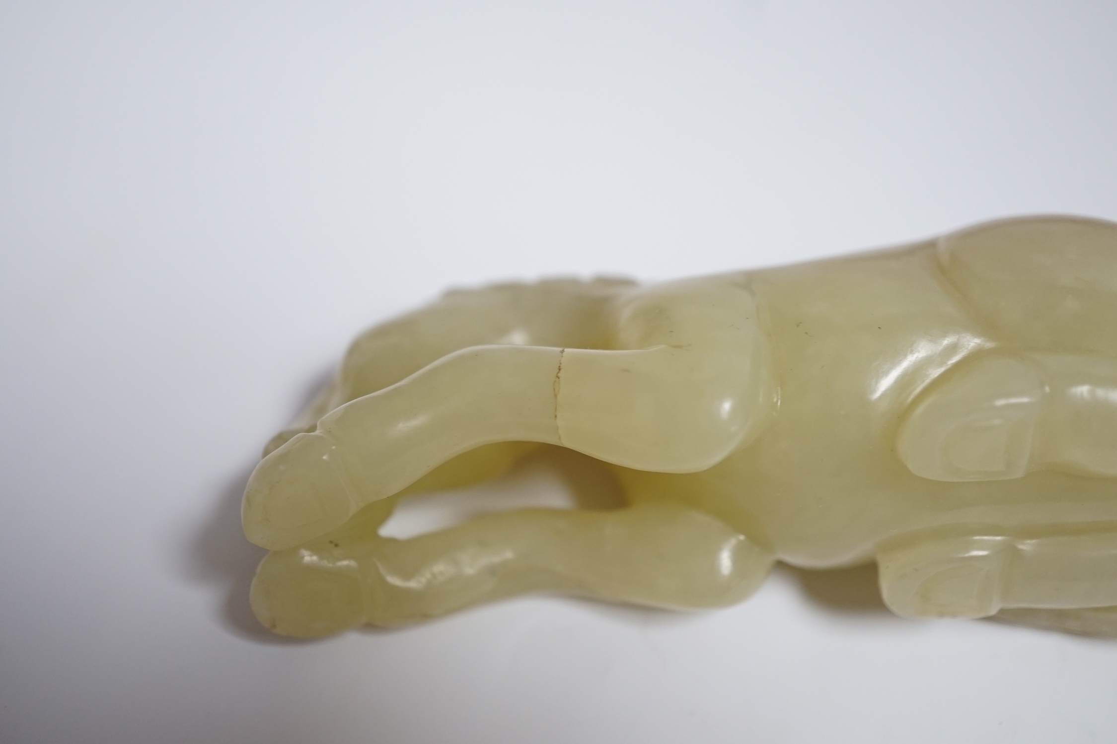 Two Chinese carved jade figures of horses on stands, largest 11cm wide